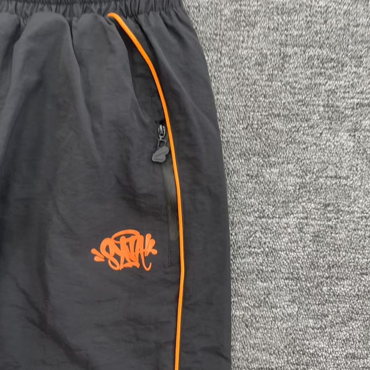 Conjuto Syna World Shell-Tracksuit-Black/Orange