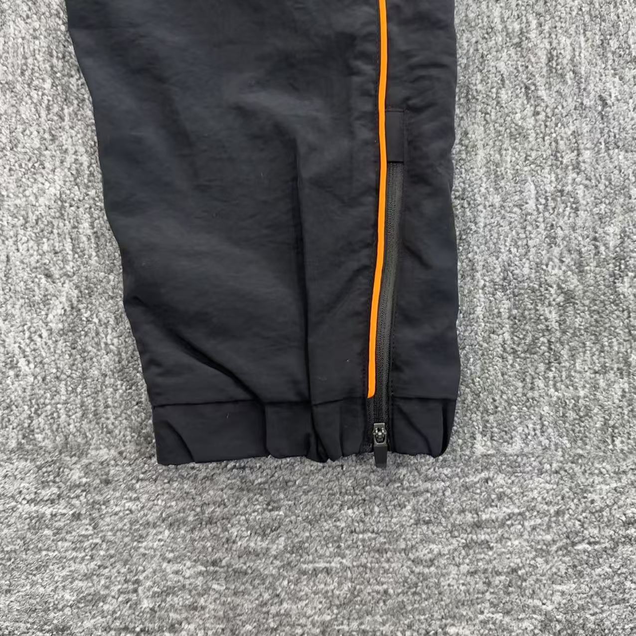 Conjuto Syna World Shell-Tracksuit-Black/Orange